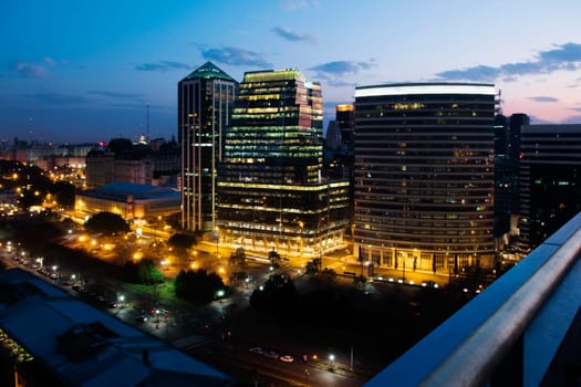 Buildings lit up at night in a city
