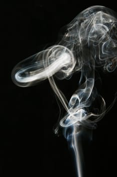 Close_up of smoke against black background