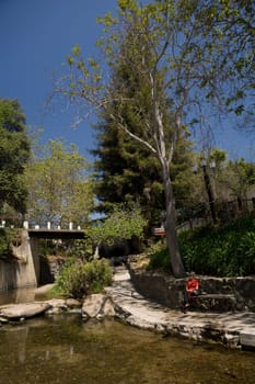 Tourist sitting at the riverbank, San Luis Obispo, California, USA