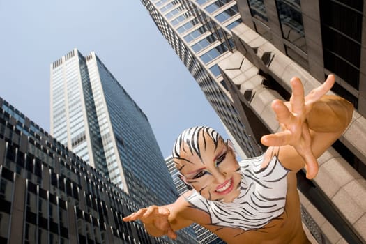 Low angle view of a young man imitating to be a tiger, New York City, New York State, USA