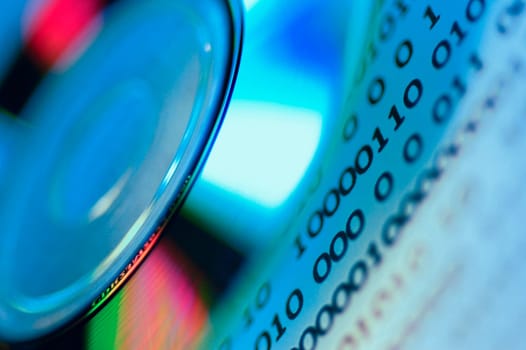 Close_up of a compact disc over a document