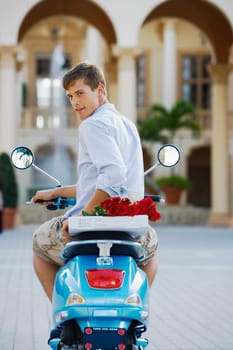 Man sitting on a moped, Biltmore Hotel, Coral Gables, Florida, USA