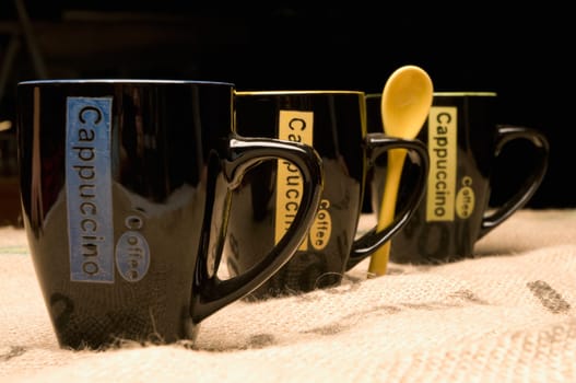Close_up of coffee cups in a row