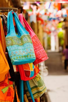 Hand bags hanging at a market stall, Sorrento, Sorrentine Peninsula, Naples Province, Campania, Italy