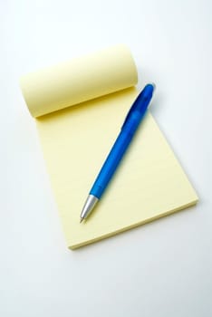 Close_up of a pen on a notepad