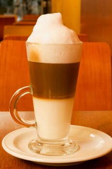 Close_up of a glass of cappuccino