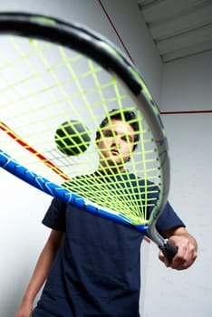 Low angle view of a young man playing tennis
