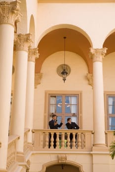 Two businessmen standing in the balcony, Biltmore Hotel, Coral Gables, Florida, USA