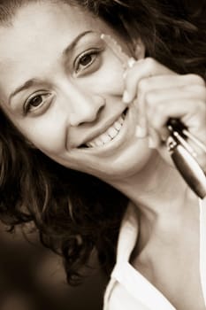 Portrait of a mid adult woman holding a car key and smiling