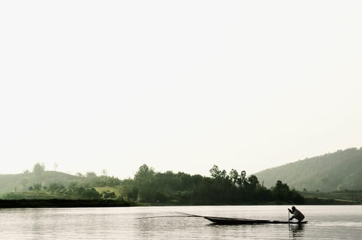 Silhouette of a person rowing a boat, Chiang Rai, Amphoe Mueang, Chiang Rai Province, Thailand