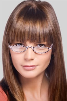Close_up of a young woman wearing eyeglasses