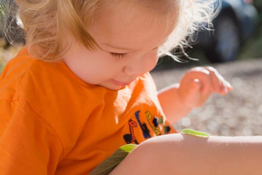 Caterpillar crawling on a baby girlŽs leg