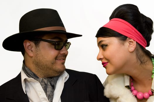 Close_up of a mid adult man with a young woman looking at each other and smiling