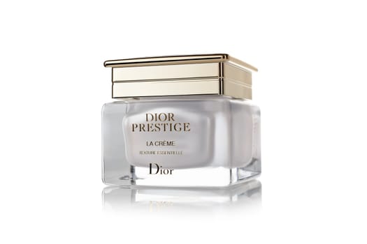 St.Petersburg, Russia - March 2020 - Bottle of cream Dior Prestige La Creme texture essentielle on white background. Product  from Christian Dior