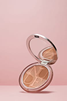 St.Petersburg, Russia - March 2020 - Palette of powder Diorskin mineral nude bronze on pink background. Product  from Christian Dior