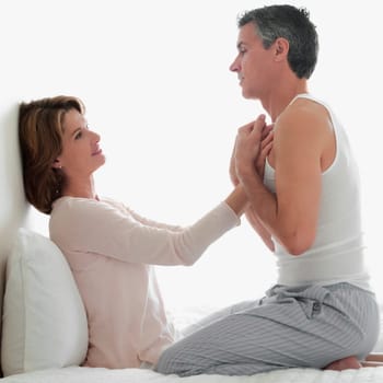 Couple romancing in the bedroom