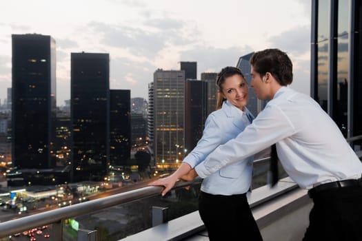 Side profile of a businesswoman and a businessman romancing
