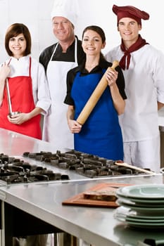 Chefs standing in the kitchen