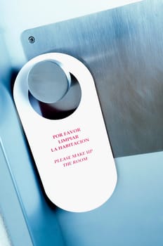 Close_up of an information tag hanging on a doorknob