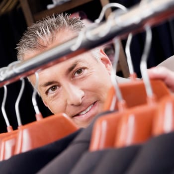 Close_up of a businessman in a clothing store