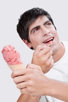 Close_up of a man eating an ice cream