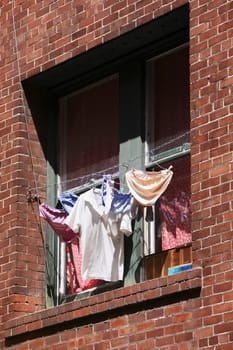 Low angle view of clothes drying on a window, Chinatown, San Francisco, California, USA