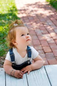Baby girl looking up