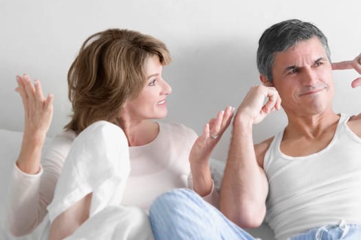 Woman arguing with a man in the bedroom