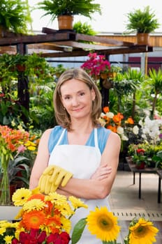 Woman standing in a greenhouse