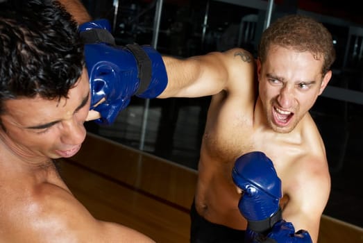 Two male boxers fighting