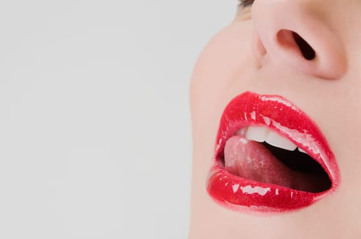 Close_up of a young woman with her mouth open