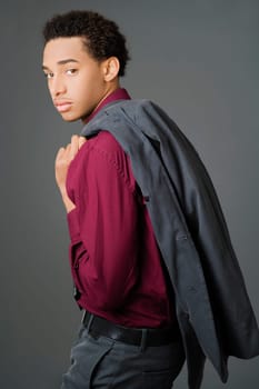 Portrait of a businessman carrying his coat over his shoulder