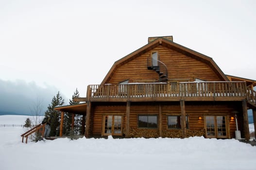 Facade of a house at a snow covered landscape, West Yellowstone, Gallatin County, Montana, USA