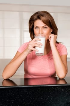 Woman drinking milk from a glass