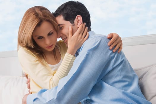 Close_up of a mid adult couple embracing each other