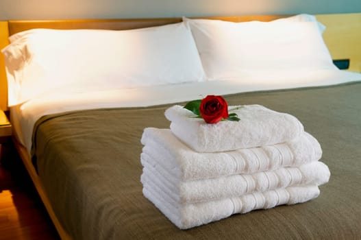 Towels on the bed in a hotel room
