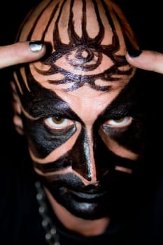 Portrait of a mid adult man with face paint on his face