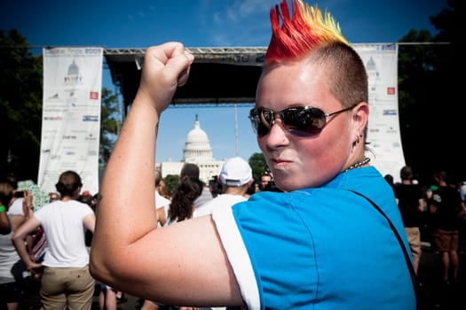Close_up of a lesbian woman flexing muscles, Washington DC, USA
