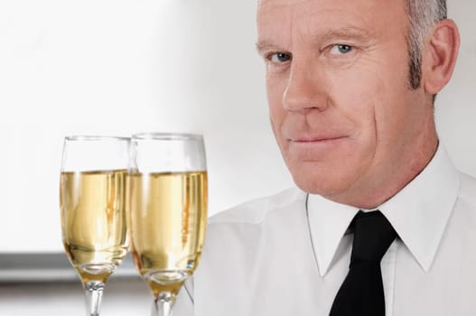 Waiter holding a tray of champagne flutes