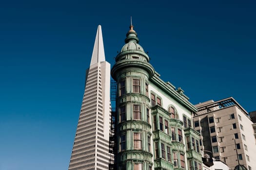 Low angle view of skyscrapers in a city, Columbus Tower, Transamerica Pyramid, San Francisco, California, USA