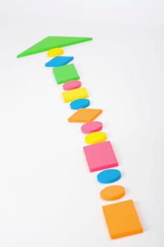 Close_up of objects making an arrow sign