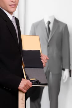 Customer holding fabric swatches in a clothing store