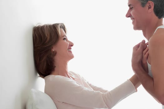 Couple romancing in the bedroom