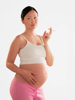 Pregnant woman smoking a cigarette