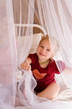 Portrait of a baby girl sitting with her mother