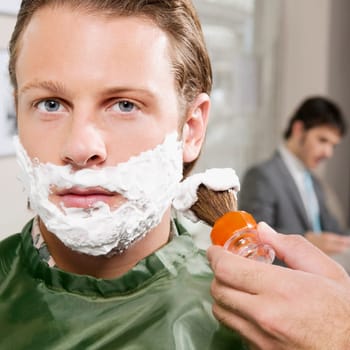 Man getting shaved in a salon