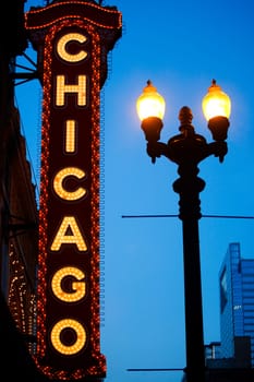 Low angle view of Chicago neon sign lit up at dusk, Chicago Theatre, Chicago, Illinois, USA