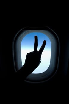 Close_up of a personŽs hand showing peace sign