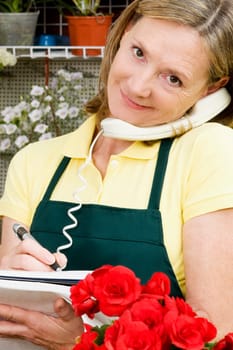 Female florist talking on the phone