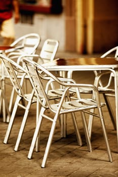 Close_up of an empty table and chairs in a sidewalk cafe